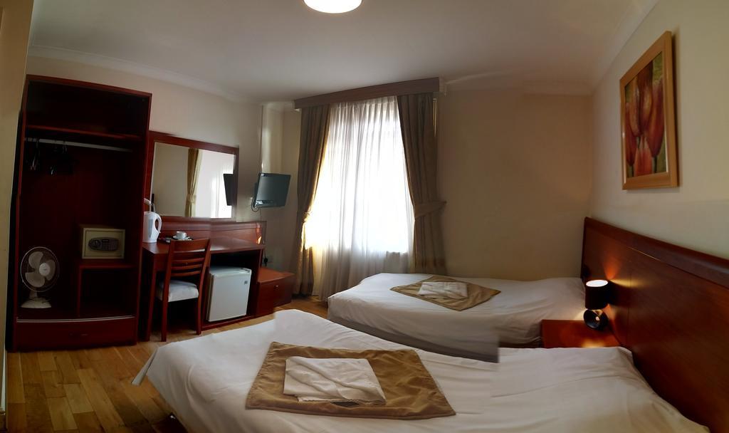 Corner House Hotel Londres Quarto foto